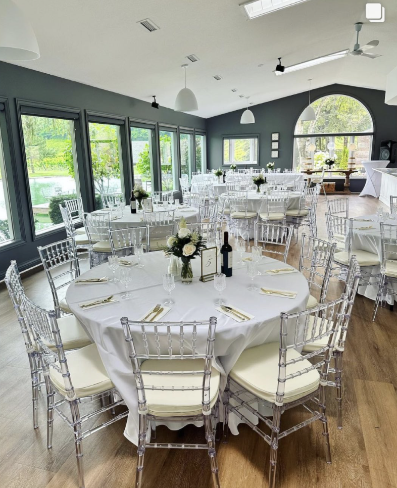 Round-table reception setup in classic white